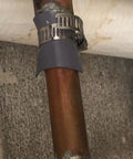 Pipe Leak Repair Kit With 6 Patches And Stainless Steel Clamps on copper pipe, no water shut off needed, flexible rubber patch shown in use.