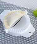 No Fuss Dumpling Maker Press Kit 3Pcs Small Nonstick Plastic Dumpling Mold with dough on grid background