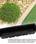 2 Pack Reusable Plastic Stepping Stone Molds For DIY Concrete Paths And Garden Walkways, laying on gravel near greenery