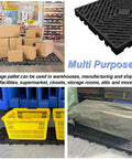 10 Pcs Lightweight Plastic Pallets 11.8 By 23.6 By 1.18 Inch Waterproof Moisture Proof Floor Pallets For Garage Basement Industrial Storage With Grid Ventilation Blue And Black in use in a warehouse setting.