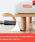Flexible Plastic Leveling Shims Set 75 Pack supporting a wooden bed leg, highlighting non-slip grip feature, for home improvement.