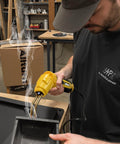 Person using 2 In 1 Plastic Welder Kit For Car Bumpers And Plastic Repairs with yellow Allturn fast heat tool in workshop