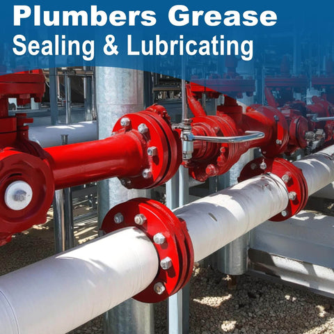 Industrial pipes with red flanges, showcasing plumbers grease application for sealing and lubricating connections.