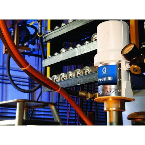 Pneumatic Drum Pump, 3/8 NPT, 140 psi installed in industrial setting with connected hoses and pressure gauge.