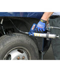 Heavy Duty Pneumatic Grease Gun With 30 Inch High Pressure Hose And 6000 PSI Power, being used on vehicle wheel for lubrication