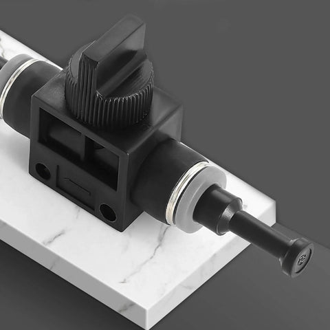 Close-up of a pneumatic plug from a 30 Pack Pneumatic Cap Style Plug Fittings Set With Push To Connect Air Line Plugs on marble surface.