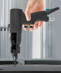 Industrial Grade Pneumatic Rivet Nut Gun Kit With Heads For 10-24 1/4 5/16 And 3/8 Inch Sizes Quick Change Nosepiece 20 Mandrels Included Air Rivnut Pull Setter For Auto Body Metal Fabrication And Heavy Duty DIY Projects in use, side view held by a hand.