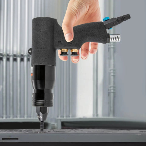 Industrial Grade Pneumatic Rivet Nut Gun Kit With Heads For 10-24 1/4 5/16 And 3/8 Inch Sizes Quick Change Nosepiece 20 Mandrels Included Air Rivnut Pull Setter For Auto Body Metal Fabrication And Heavy Duty DIY Projects in use, side view held by a hand.