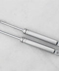 Vertical Swing Lift Up Stay Pneumatic for Cabinet Door hardware, silver finish; two durable pneumatic arms on display.