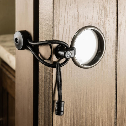 Pocket Door Holder With Bungee Cord And Pull Tab For RVs And Cabinets, securely holds doors open or closed, installed view