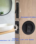 Image of a Pocket Door Keyed Lock With Flush Handles For Recessed 2 Sided Sliding Barn Door Latch, Round Contemporary Entrance Hardware, 2-3/8 Inch Backset, Matte Black Finish, Easy Grip Lever For Left Or Right Handed Doors, installed on a wooden door, showing detailed measurements.