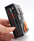 Side view of ATC Cards Pocket Folder Metal Cutting Dies Stencil Set for DIY Scrapbooking, held by hand, showing layered design.