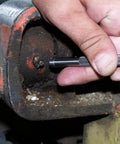 Hand using Pocket Model Grease Joint Rejuvenator Tool By IPA Tools Innovative Products Of America for unclogging a grease joint