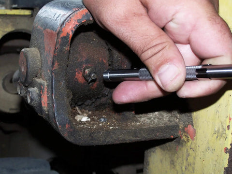 Hand using Pocket Model Grease Joint Rejuvenator Tool By IPA Tools Innovative Products Of America for unclogging a grease joint