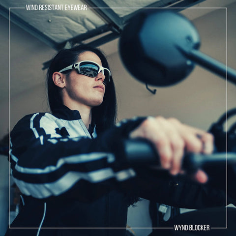 Person wearing Blocker Polarized Motorcycle Riding Sunglasses Sports Wrap Black Smoke Lens on a motorcycle.