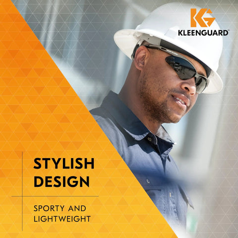 Worker wearing Polarized Safety Glasses With Smoke Lenses Gunmetal Frame Unisex Case Included, helmet on construction site.