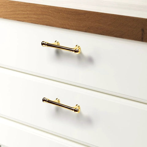 Installed view of 10 Pack Polished Brass Kitchen Cabinet Pulls 3 Inch Hole Center Solid Zinc Alloy Handles on white drawers