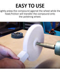 Person using three piece buffing and polishing compound kit with red coarse, white medium, and green fine bars on a wheel