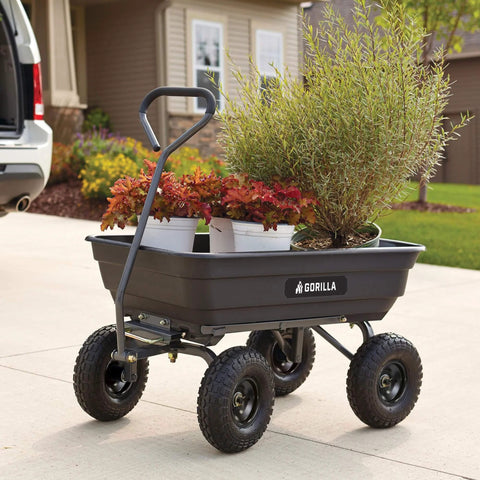 Poly Garden Dump Cart with 4 Cu Ft Tub 600 LB Haul Capacity Heavy Duty Utility Wagon with plants in a driveway