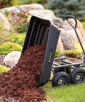 Poly Garden Dump Cart with 4 Cu Ft Tub 600 LB Haul Capacity Utility Wagon with dumping mulch in garden
