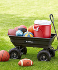 Poly Garden Dump Cart with 4 Cu Ft Tub 600 LB Haul Capacity Heavy Duty Utility Wagon loaded with balls and a cooler on grass.