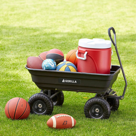 Poly Garden Dump Cart with 4 Cu Ft Tub 600 LB Haul Capacity Heavy Duty Utility Wagon loaded with balls and a cooler on grass.