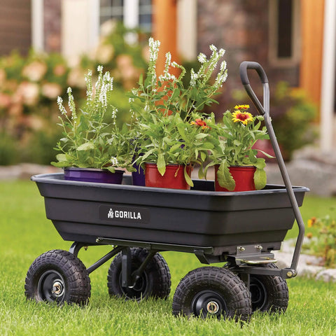 Poly Garden Dump Cart with 4 Cu Ft Tub 600 LB Haul Capacity Heavy Duty Utility Wagon holding potted plants on grass