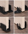 Two Pieces POM Barn Door Floor Guides For Universal Sliding Barn Door Hardware Flat Bottom Track Guide Swing Stopper Black Size 1.8x0.8x0.9 Inch With 28mm Hole Spacing Durable Floor Mount Guides installed on wooden door.