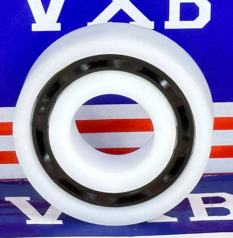 Side view of R14 Plastic Bearing - POM - SS316 Stainless Steel Balls - Food Grade - 7/8" x 1-7/8" x 1/2" inch against VXB backdrop