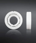 Bearing Replacement Kit For Hayward Navigator Automatic Pool Cleaner By Swimables, front and side view of white bearing with stainless steel balls