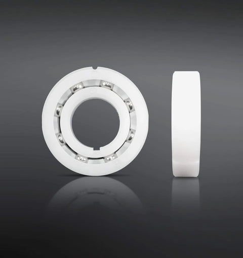 Bearing Replacement Kit For Hayward Navigator Automatic Pool Cleaner By Swimables, front and side view of white bearing with stainless steel balls
