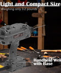 Portable 140A 110V IGBT Inverter Handheld Welder With Hot Start Arc Force Anti Stick and Base Stand on workbench