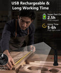 Man using Portable LED Work Light 4 Pack With Magnetic Base And Hanging Hook in workshop, showing USB rechargeability.