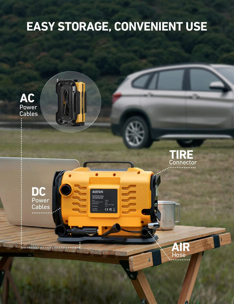 Portable Tire Inflator With Dual Power Motors and Bright LED Light 150 PSI 12V DC or 110V AC on a wooden table near a car