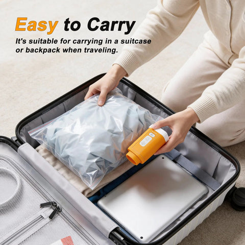Person using Portable Vacuum Storage Bag Pump Cordless Travel Electric Rechargeable Compression Vacuum Pump to save suitcase space