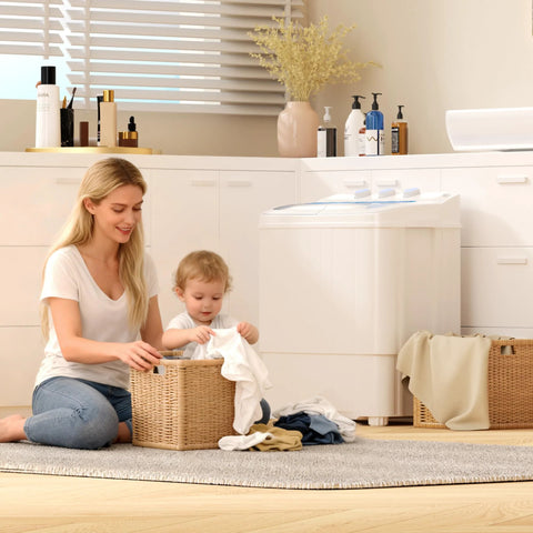 Compact 16 lb portable washer dryer combo in a small apartment laundry area with a woman and child folding clothes.