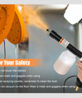 Person using Powder Coating System With Electrostatic Output Dual Voltage 20Kv And 50Kv spraying orange powder coating on product