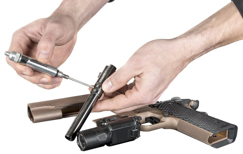 Person using Precision Oiling Pen For Tight Spots And Machinery Titan 15200 Precision Oiler on a disassembled gun component.