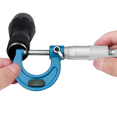 Close-up of 0-1 inch micrometer from Outside Micrometer Set 0 To 4 Inch 4 Piece 0.0001in Graduation Carbide Anvils Case in use.