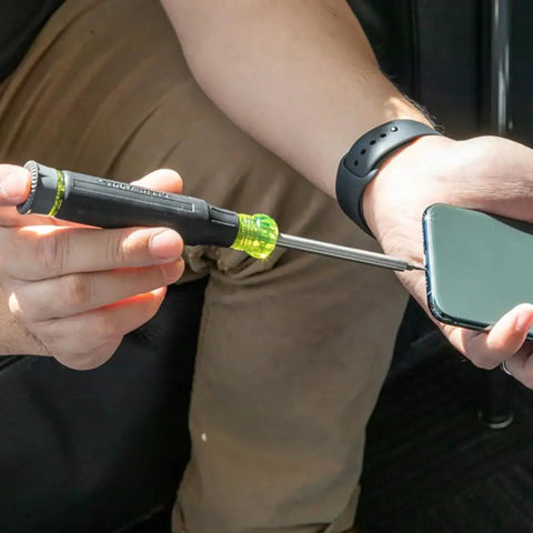 Person using All-In-One 27-In-1 Precision Screwdriver Set For Apple Device Repairs With Rare-Earth Magnet Barrel on a smartphone.