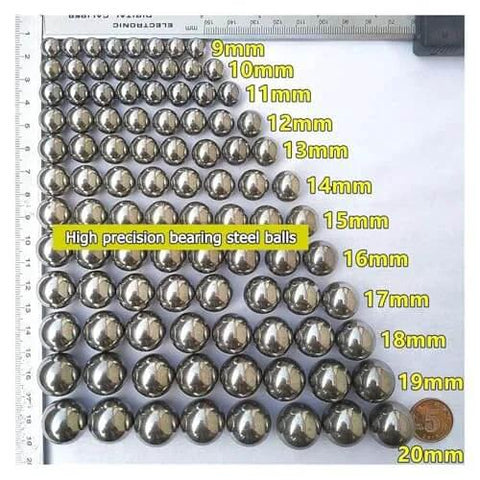 High precision steel balls in various sizes from 9mm to 20mm, with a measurement ruler for scale, showcasing smooth metallic surface.