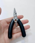All In One Candle Making Kit For DIY Fans With Punching Needle Wick Insertion Tools Large Eye Hook Mold Wicks And Other Candle Making Essentials In A Durable Portable Case By Phinicco - Close-up of needle nose pliers with black handles.