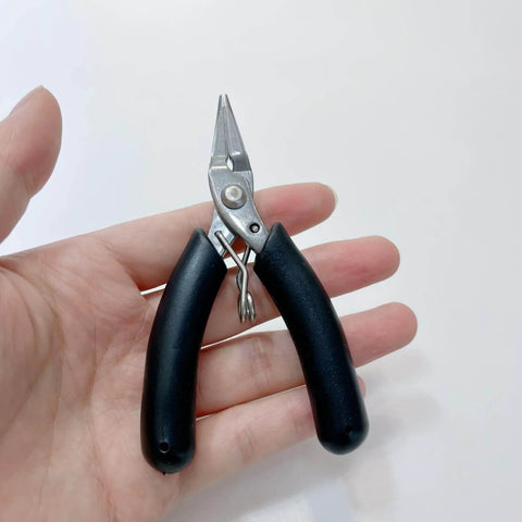 All In One Candle Making Kit For DIY Fans With Punching Needle Wick Insertion Tools Large Eye Hook Mold Wicks And Other Candle Making Essentials In A Durable Portable Case By Phinicco - Close-up of needle nose pliers with black handles.