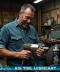 Mechanic using Premium Pro Grade Air Tool Lubricant for pneumatic tools in industrial setting, 4 oz bottle by CLIsyntec visible in workshop.