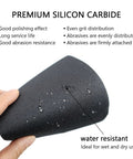 Hand holding a water-resistant silicon carbide sheet from Hand Sanding Blocks Set For Auto Body And Woodworking 25 Pcs Grit 120 To 3000.