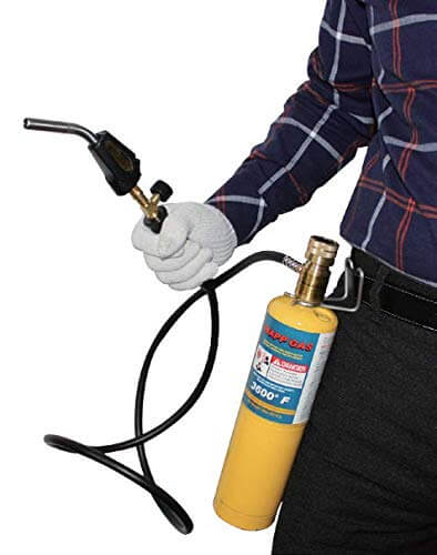 Person using Pro Grade Propane Torch With 60 Inch Hand Hose For MAPP Gas And Welding Tasks, Lightweight Yet Rugged With Hook.