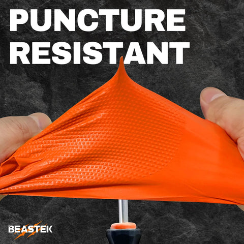 Hands stretching 8 Mil Nitrile Powder Free Gloves Diamond Textured Heavy Duty Orange 100Pcs showcasing puncture resistance.