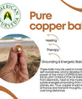 Hand holding 2 Inch 1 Ball Copper Ball for Integrity, Clear Thinking, and Natural Energy Meditation, promoting mental agility and grounding.