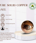 1.5 Inch Pure Solid Copper Ball 2 Pack Sphere Orb with therapy benefits on a wooden stand