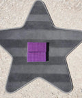 Star-shaped mat with Auto Carpet Brush Tool And Interior Vacuum Line Maker in purple, showing crisp stripe patterns on vehicle upholstery.